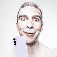 a man very happy about his phone