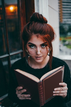 woman reading a textbook