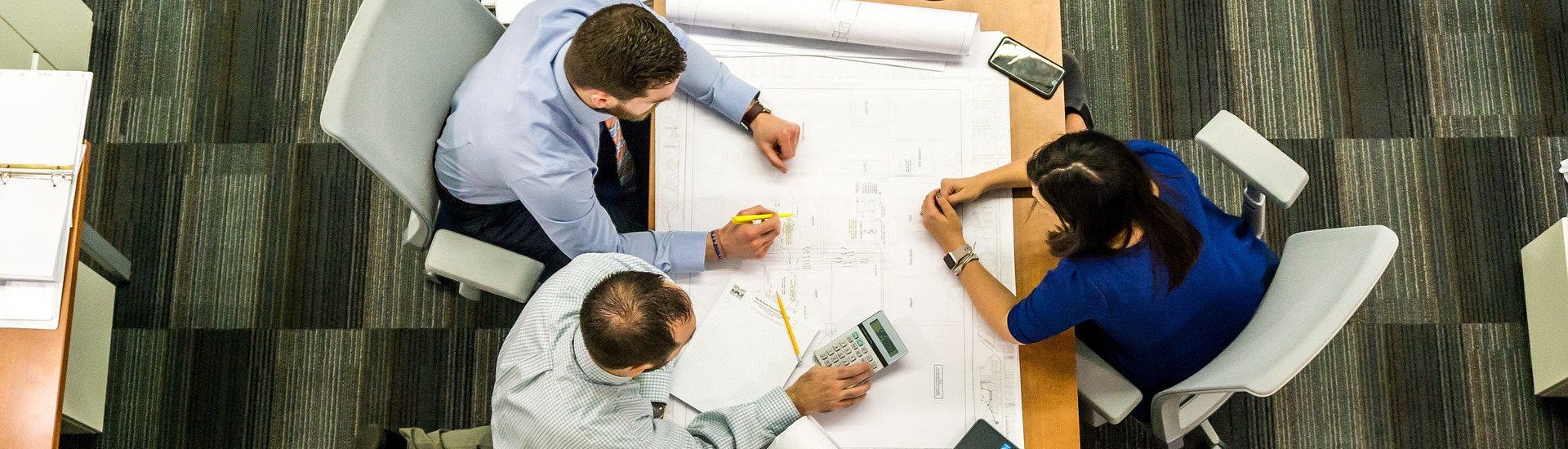 three engineers in a planning meeting