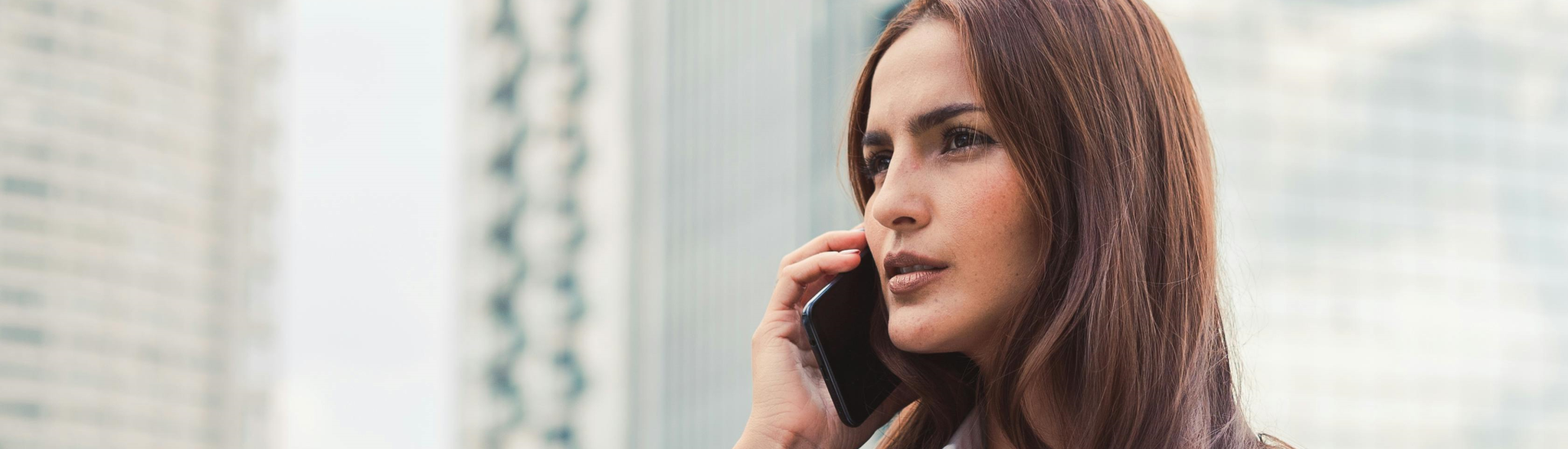 wistful woman on the phone