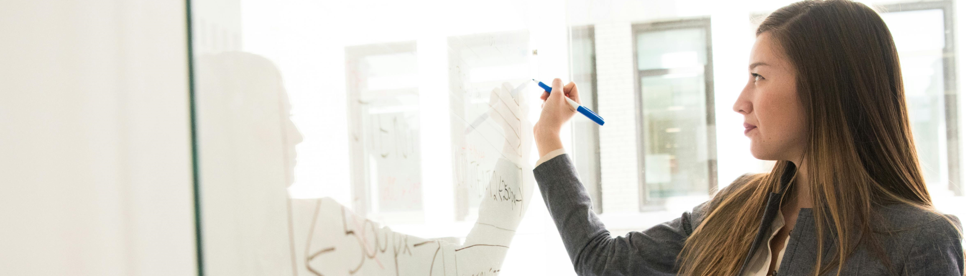 Business woman at white board