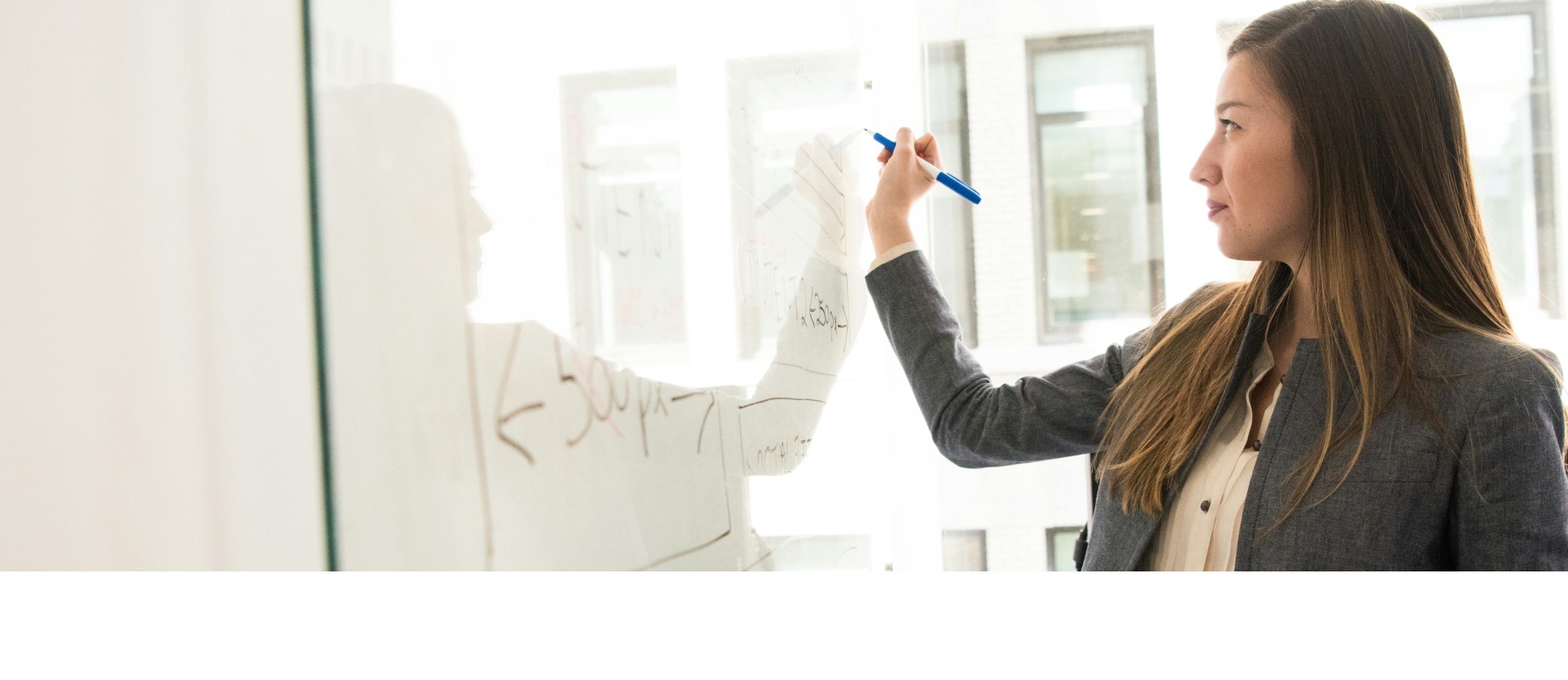 woman at white board